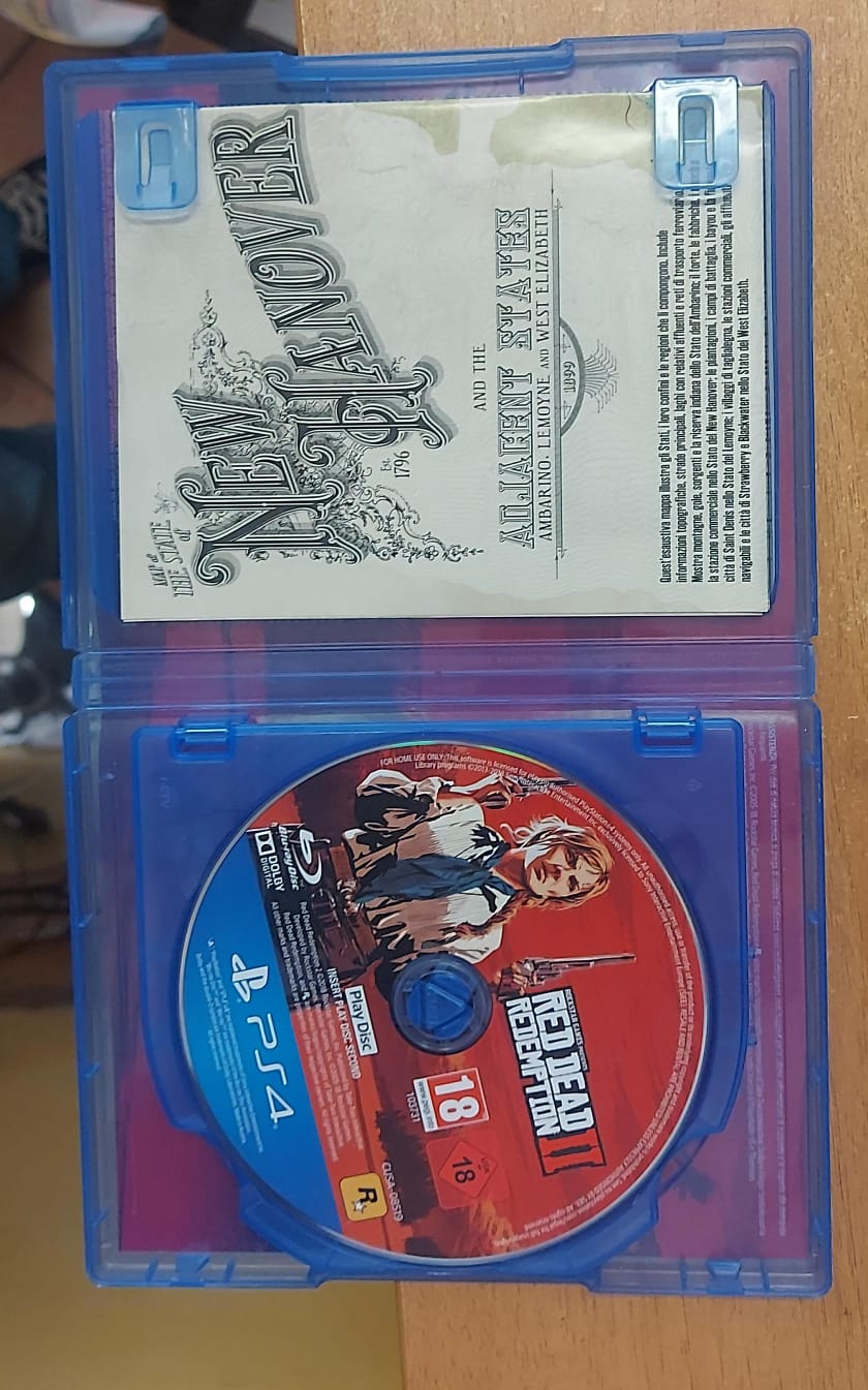 Red Dead Redemption 2 PS4 - interno con Play Disc e mappa cartacea